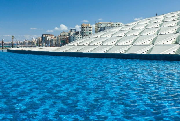 View of blue water and modern architectural structure.