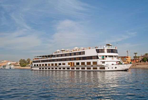 Sail nile river cruises White cruise ship on calm water under blue sky.