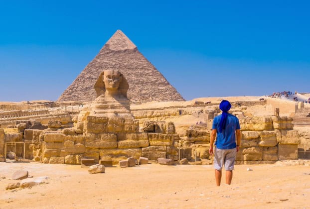 Person gazing at the Sphinx and Pyramid during Egypt excursions with Discovery Tours Egypt