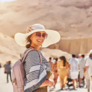 Lady in hat in Valley of the Kings, taken during a 5 Day Cairo, Luxor & Abu Simbel Tour enjoying Luxury Egypt Tours