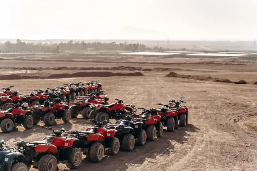 Large Column Of Atvs And Buggies Stands In The Middle Of A Sandy Desert. Ready For Fun In The Desert Large column of ATVs and buggies stands in the middle of a sandy desert. Ready for fun in the desert. Hurghada Desert Safari