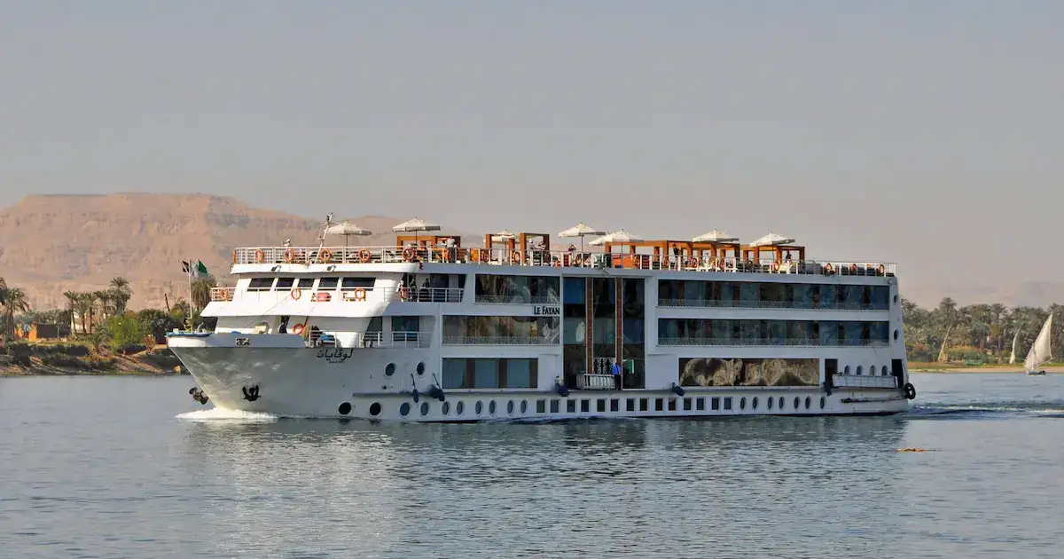 cheap nile cruises ship on the river at sunset